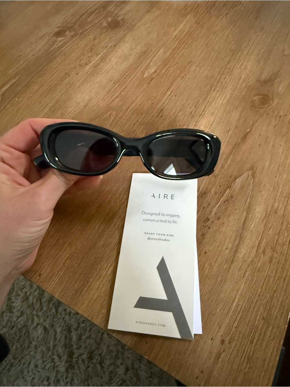 AIRE Calisto Black Oval Sunglasses